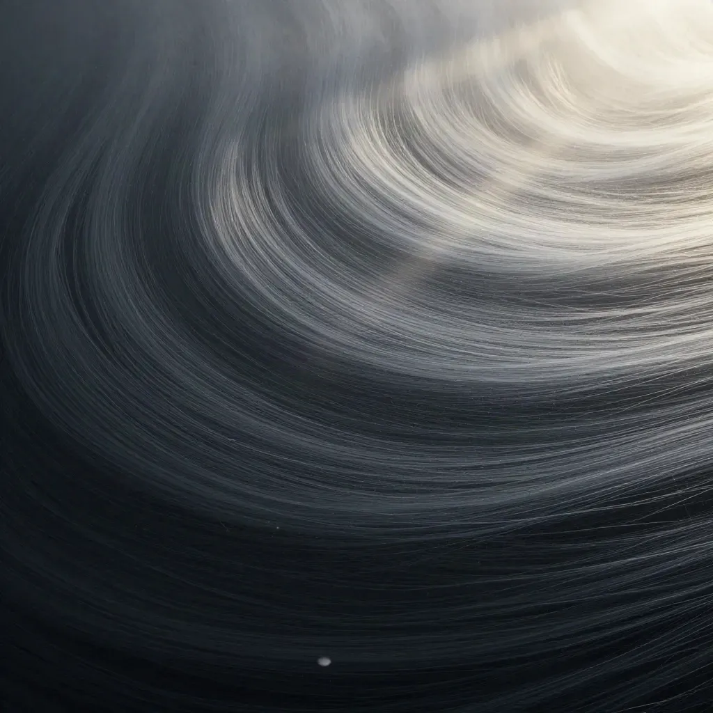 Silver filaments converge into a white bloom in dark graphite haze with drifting motes.